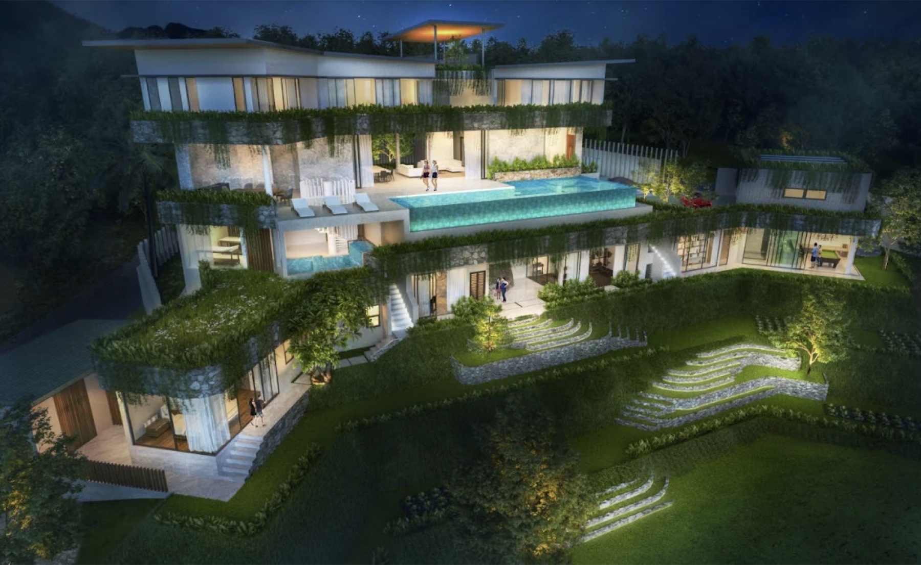 Tropical luxury villa with an infinity pool at night in Koh Samui, Thailand