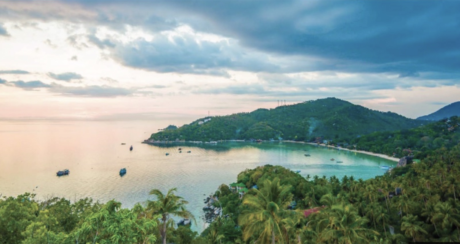 A calm tropical bay and green hills in Koh Samui